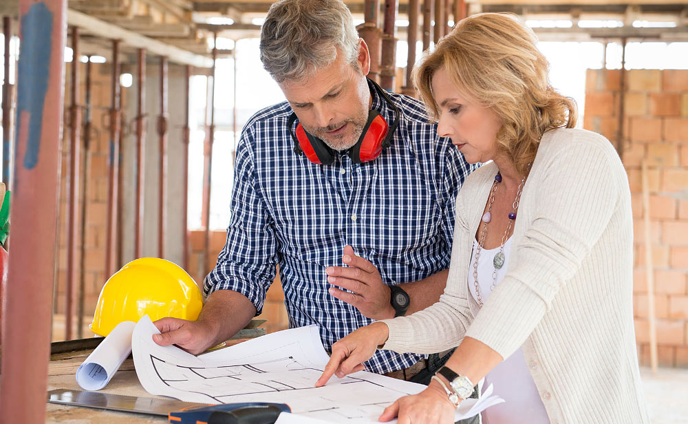 People Discussing Construction Plans People Discussing Construction Plans